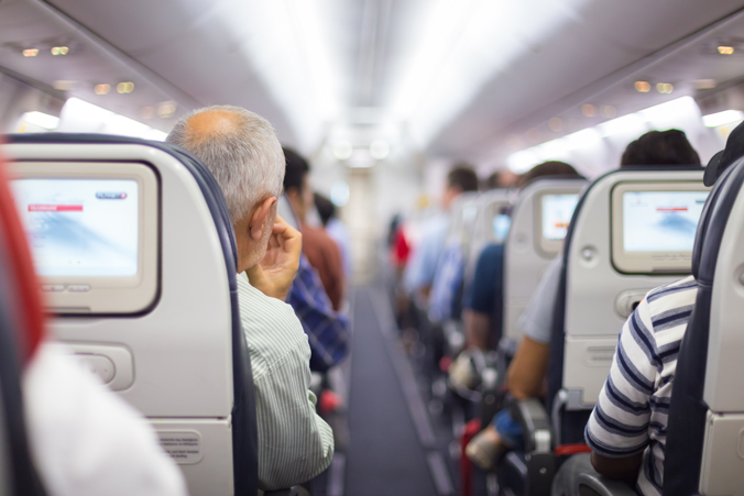 Photo of people on an airplane.